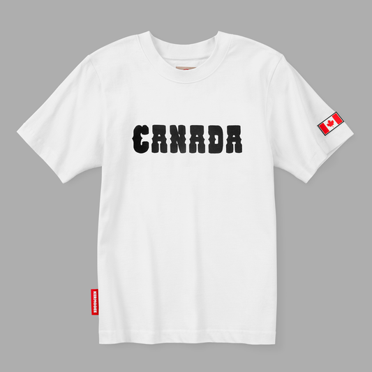 Front view of white Kermodee t-shirt with bold black CANADA lettering and red Canadian flag on sleeve.
