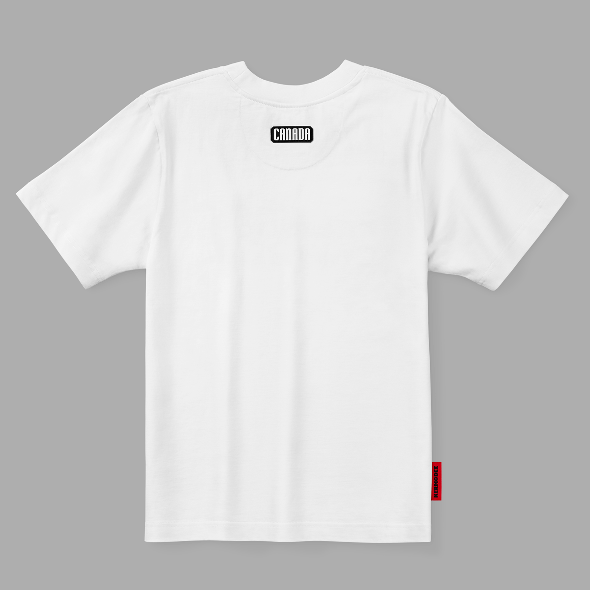Back view of white t-shirt with black and white Canada patch below neckline and red KERMODEE side label