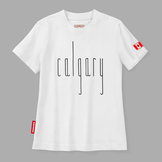 Front view of white Calgary t-shirt with thin black vertical lettering and Canada flag patch on sleeve