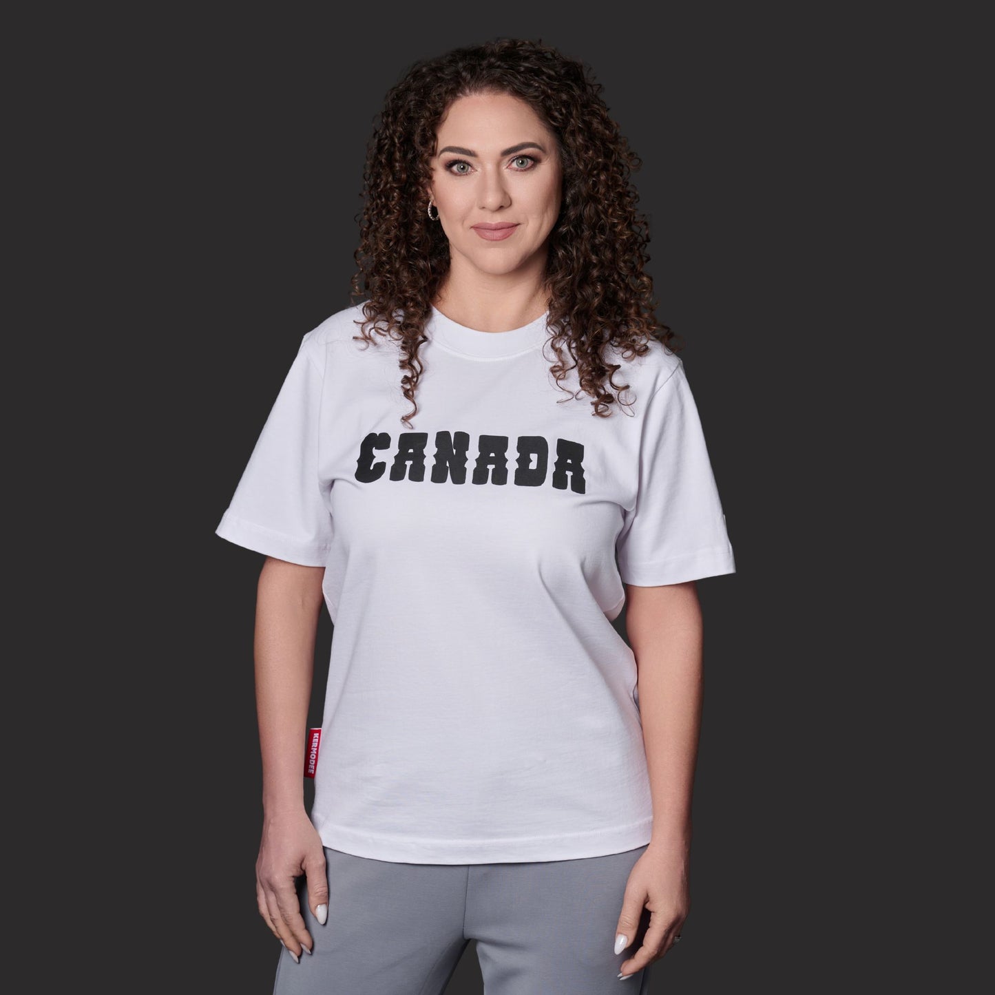 Female model wearing Canada Best Country Since 1867 Unisex T-Shirt with bold Canadian heritage graphic