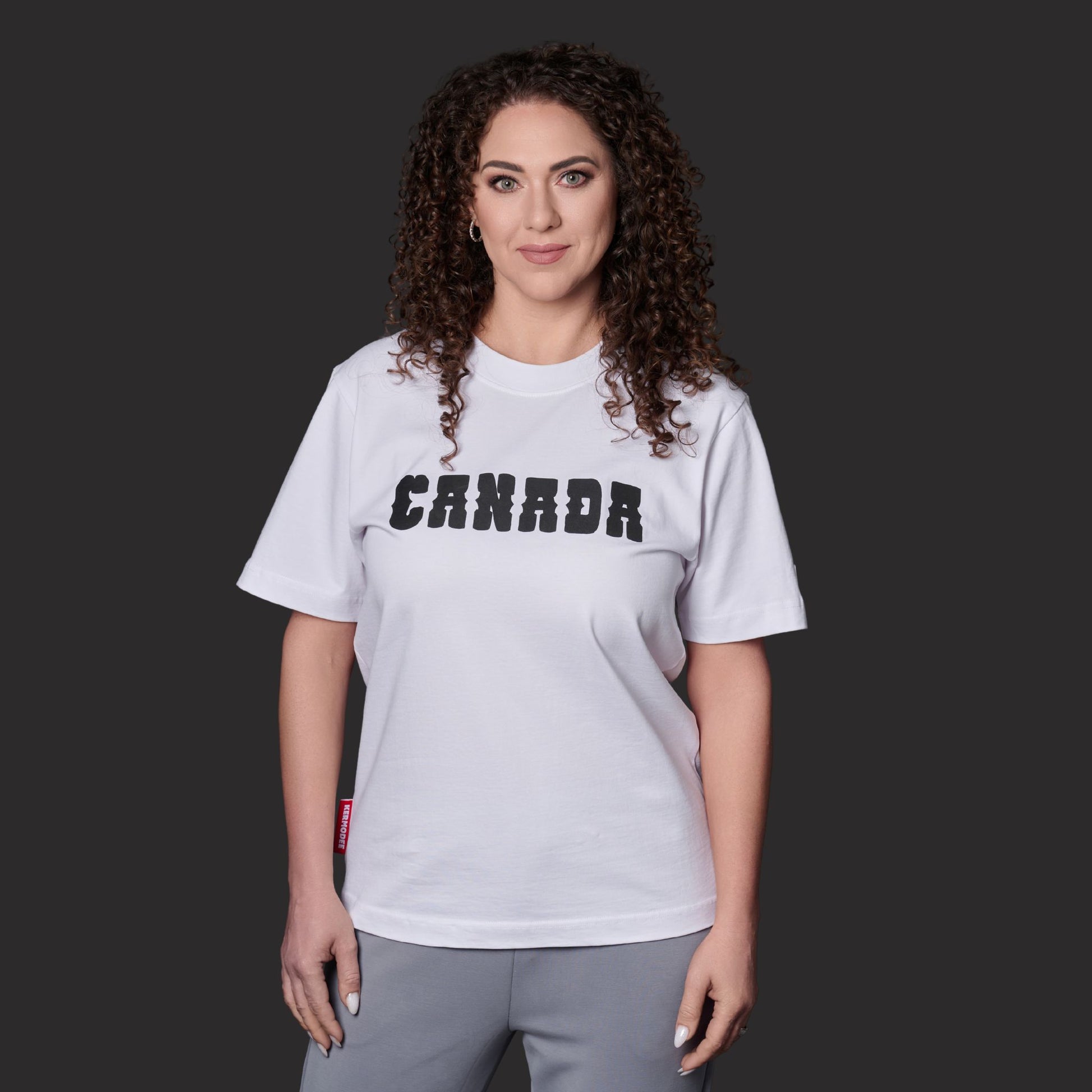 Female model wearing Canada Best Country Since 1867 Unisex T-Shirt with bold Canadian heritage graphic