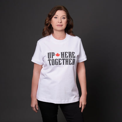 Female model wearing Up Here Together Women's Canada Unity T-Shirt with raised black lettering and red maple leaf graphic