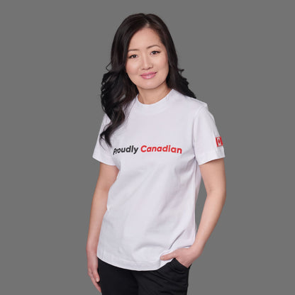 Female model wearing Proudly Canadian Women's T-Shirt in premium white cotton with raised high-density black Proudly and red Canadian typography