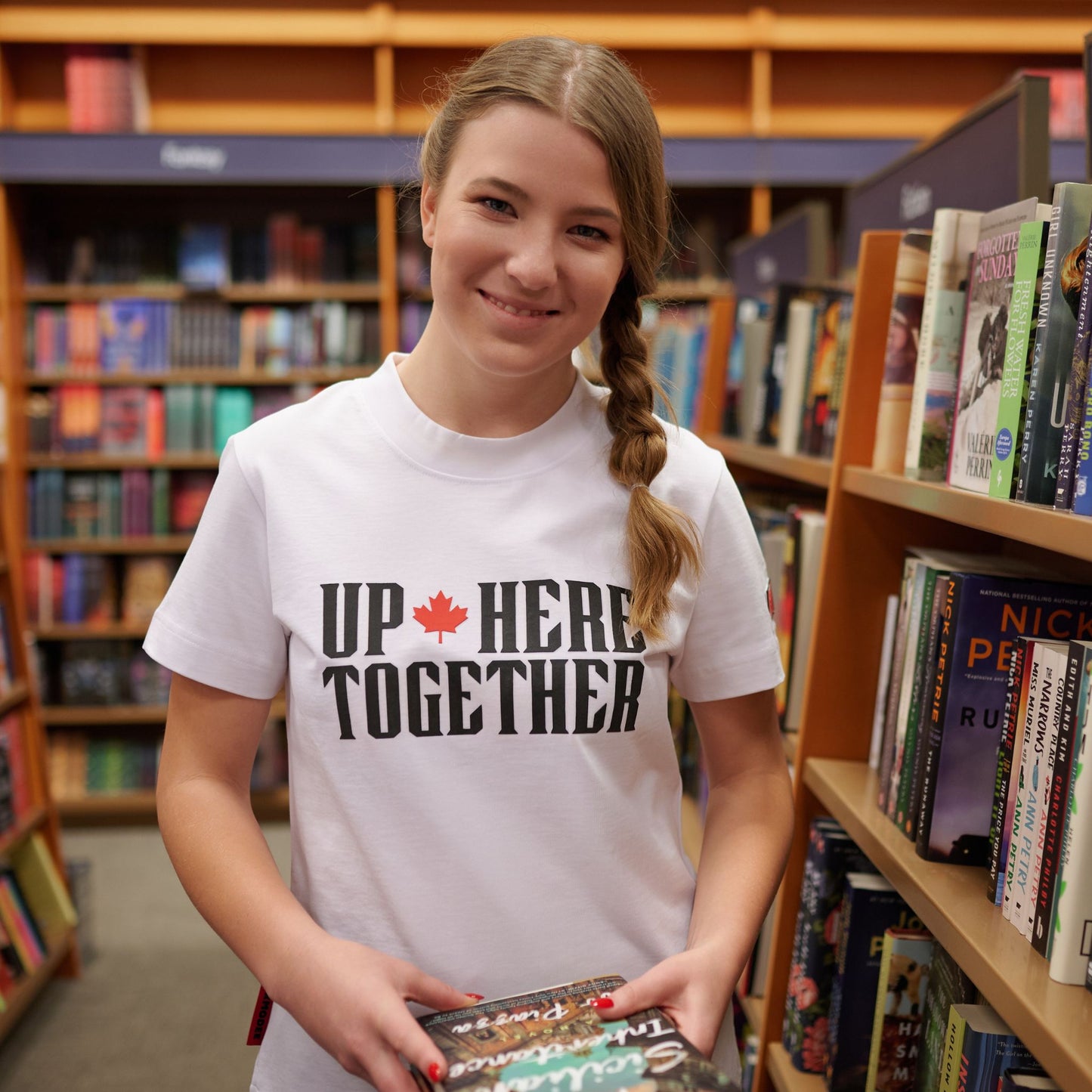 Female model wearing Up Here Together Women's Canada Unity T-Shirt in lifestyle setting