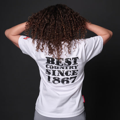 Back view of female model wearing Canada Best Country Since 1867 Unisex T-Shirt showing distressed typography print