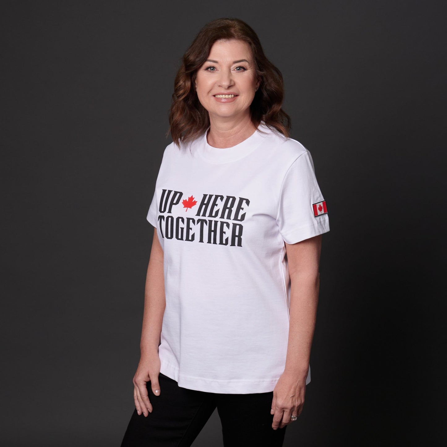 Female model wearing Up Here Together Women's Canada Unity T-Shirt in white cotton fabric