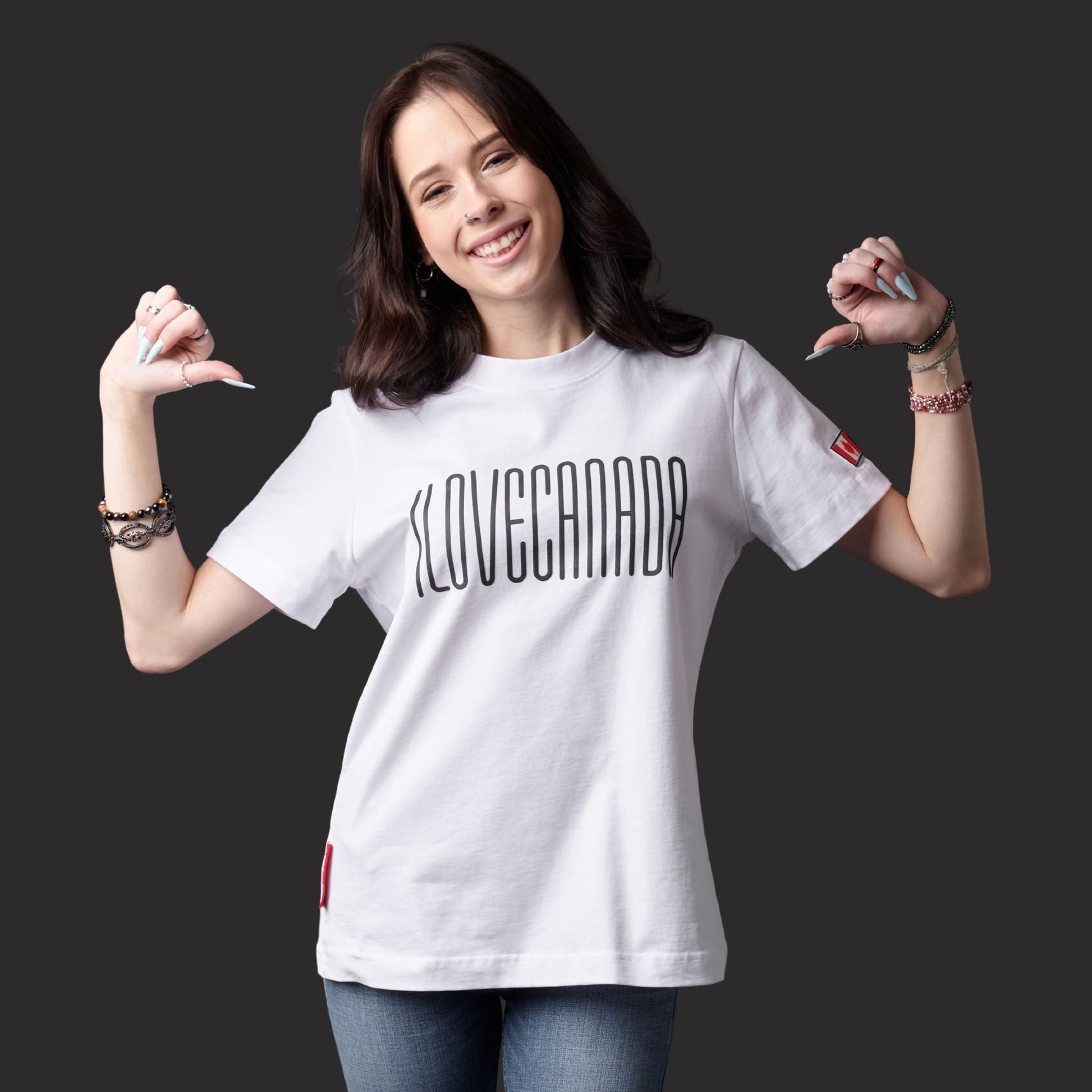 Female model wearing I Love Canada Women's T-Shirt featuring raised high-density I Love Canada lettering and Canadian pride message