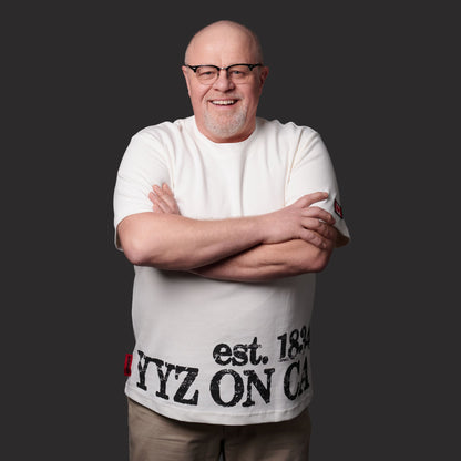 Male model wearing Toronto Ontario Heritage Premium Unisex T-Shirt featuring distressed YYZ ON CA EST. 1834 heritage print