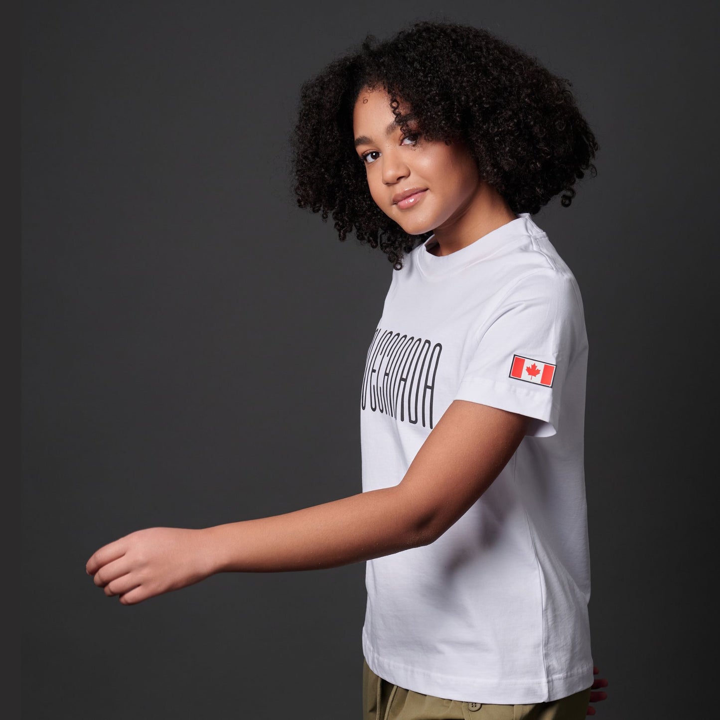 Side view of Female model wearing I Love Canada Women's T-Shirt with visible Canadian flag sleeve patch
