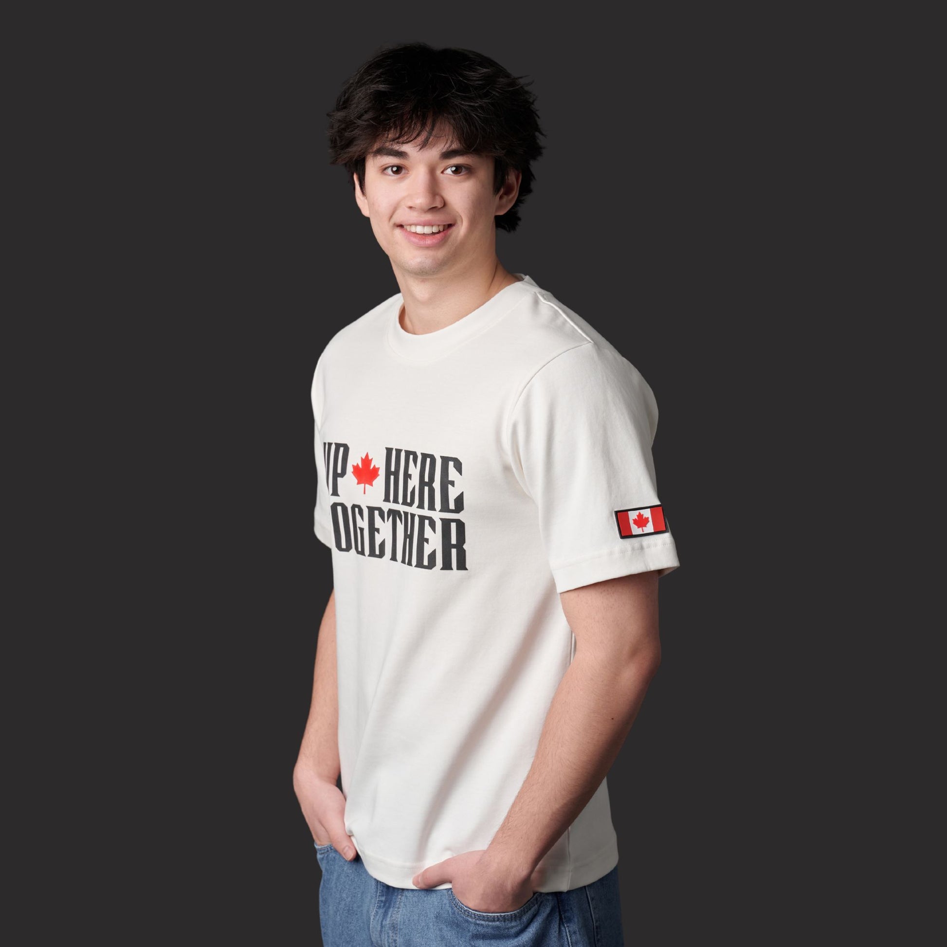 Male model wearing Up Here Together Canada Unity Unisex T-Shirt in cream off-white fabric