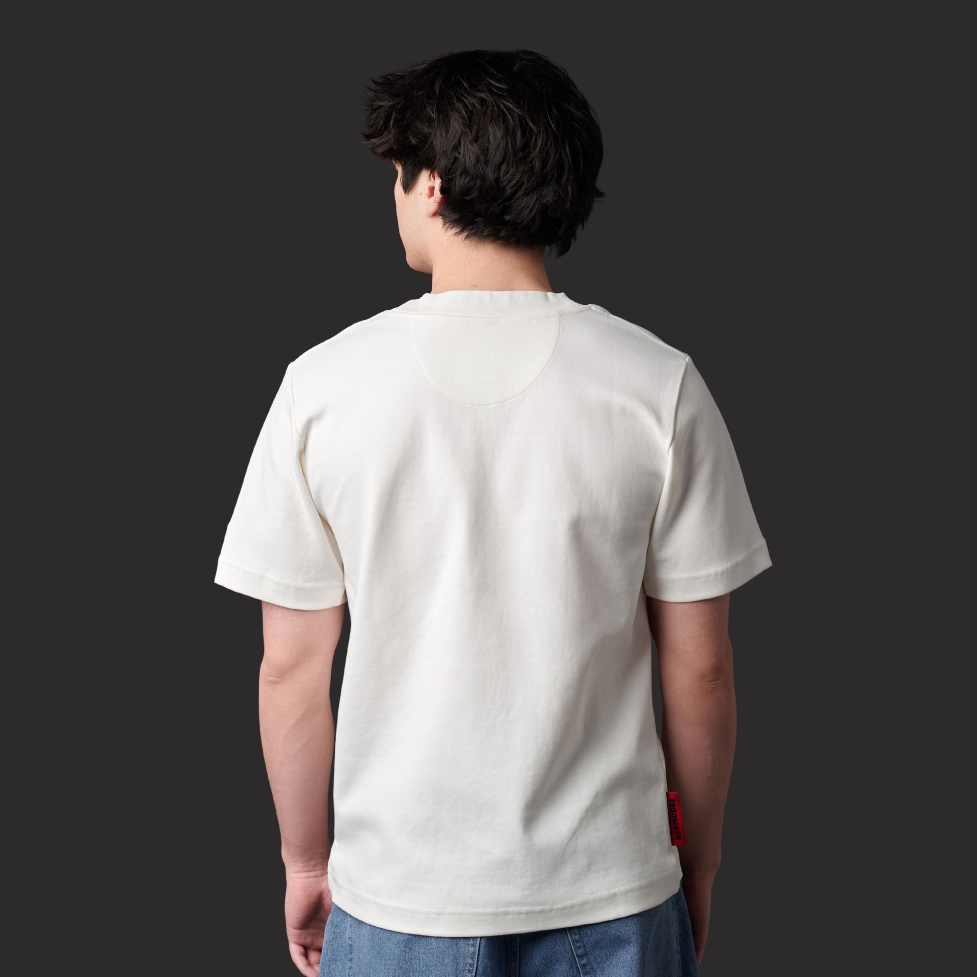 Back view of male model wearing Up Here Together Canada Unity Unisex T-Shirt showing clean rear design