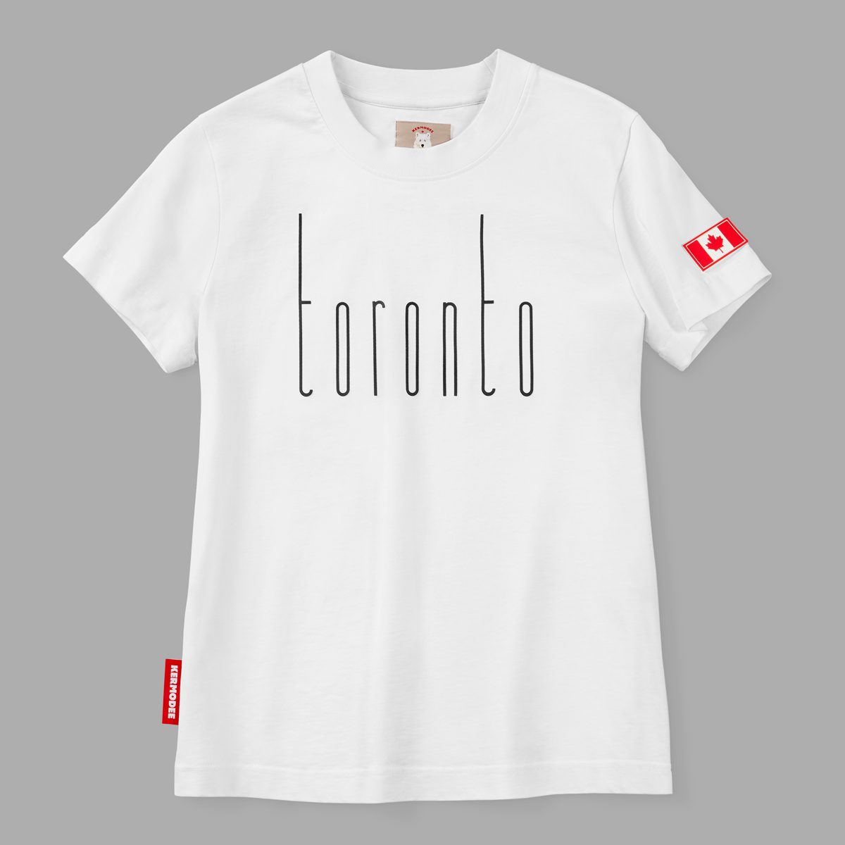 Front view of white Toronto t-shirt with thin black vertical lettering and Canada flag patch on sleeve