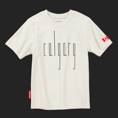 Front view of cream Calgary t-shirt with thin black vertical lettering and Canada flag patch on sleeve