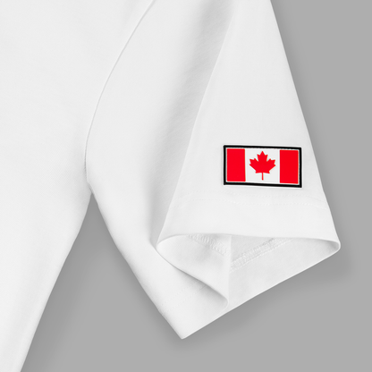 Close-up of left sleeve on white Kermodee t-shirt with red silicone Canadian flag patch.