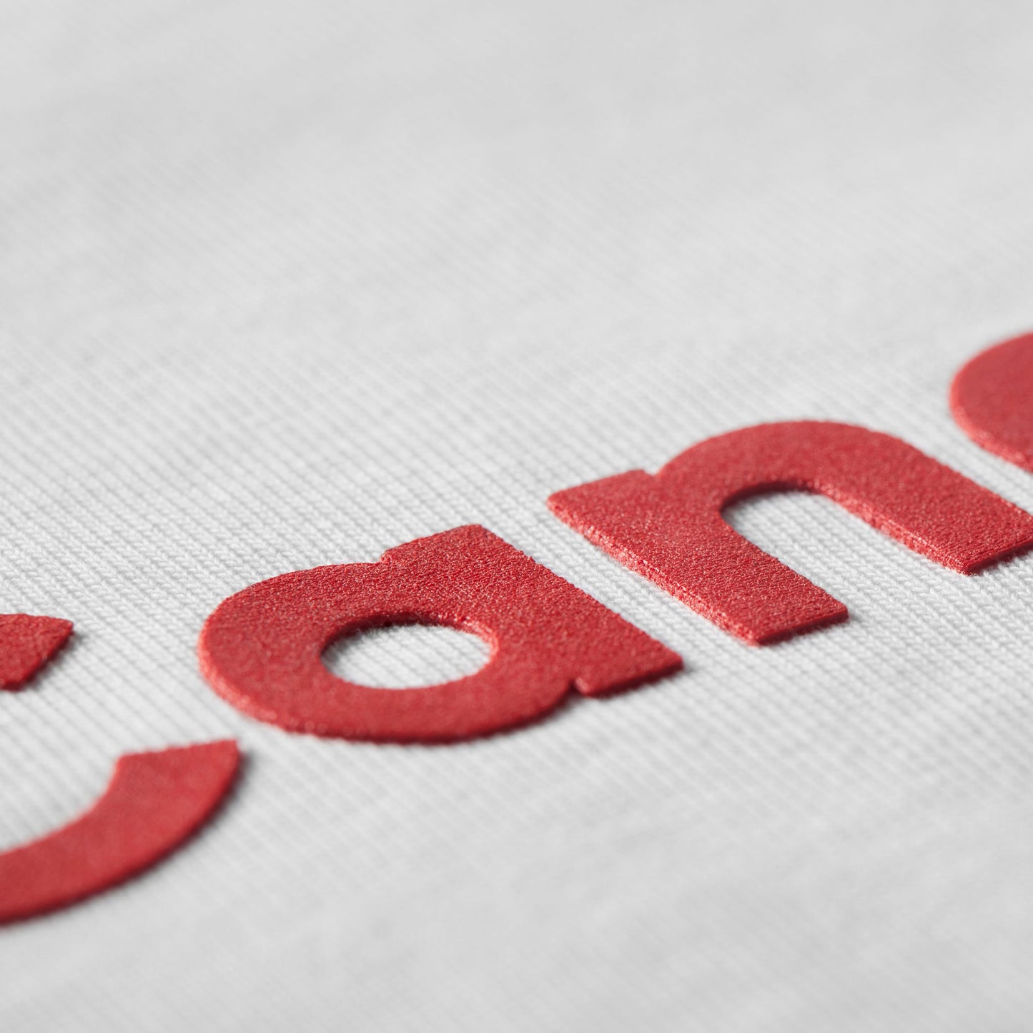 Close-up of durable raised high-density Proudly Canadian typography on Proudly Canadian Unisex T-Shirt