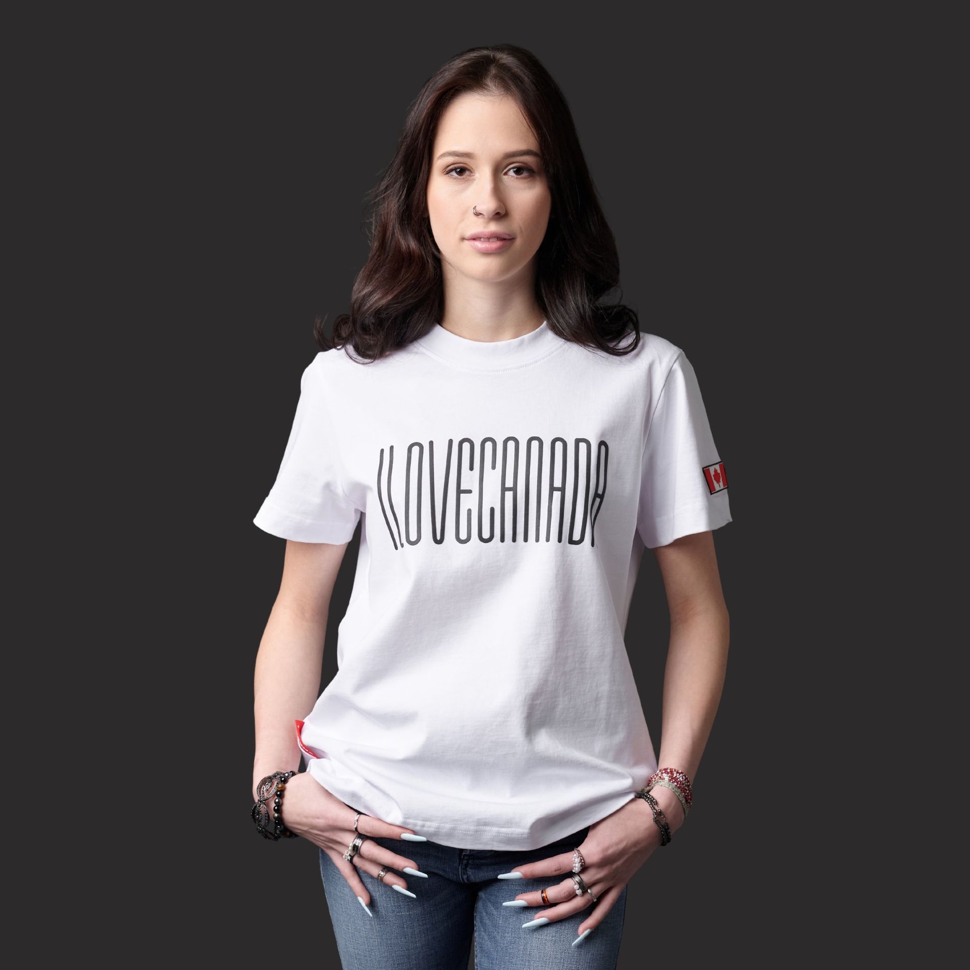 Female model wearing I Love Canada Women's T-Shirt with raised high-density black typography and Canadian pride design