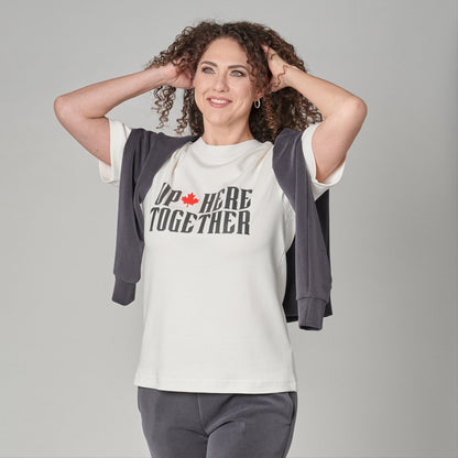 Female model wearing Up Here Together Canada Unity Unisex T-Shirt with raised lettering and maple leaf design